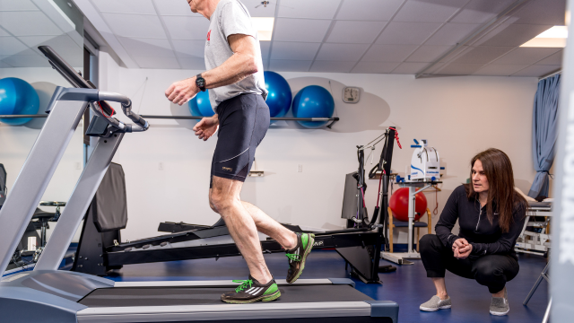 Physician monitoring someone on a treadmill